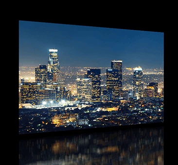 Mirror TV screen displayed tall buildings in the city from Sharjah.